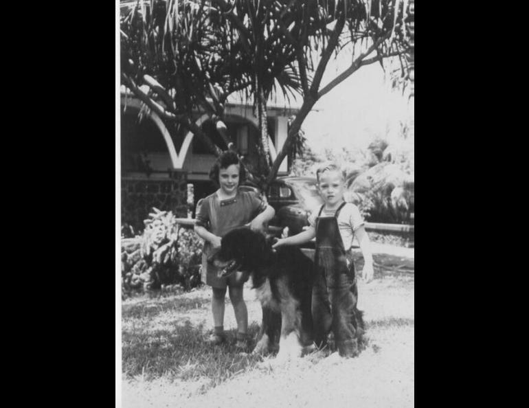  Jeanne Branch and her brother David Branch in Hilo, Hawaii. This photo was taken about one month before the April 1, 1946 tsunamis hit. The dog, Buddy, also survived the series of Alaska-generated waves that killed 96 people in Hilo. Photo from the Jeanne Branch Johnston Collection, Pacific Tsunami