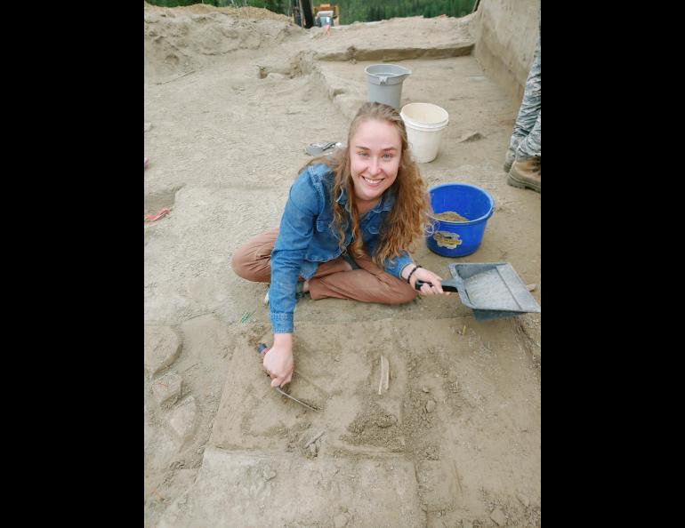  UAF Ph.D. student Audrey Rowe trowels loess soil at an archeological site in the uplands of Interior Alaska. Photo by Mat Wooller.