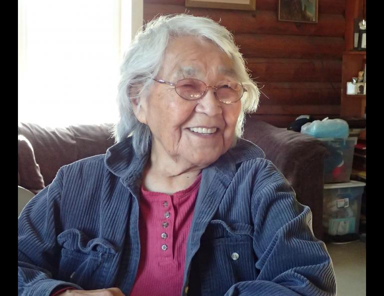 At her kitchen table in Minto, Alaska, 89-year-old Sarah Silas remembers a 1947 earthquake. Photo by Ned Rozell.
