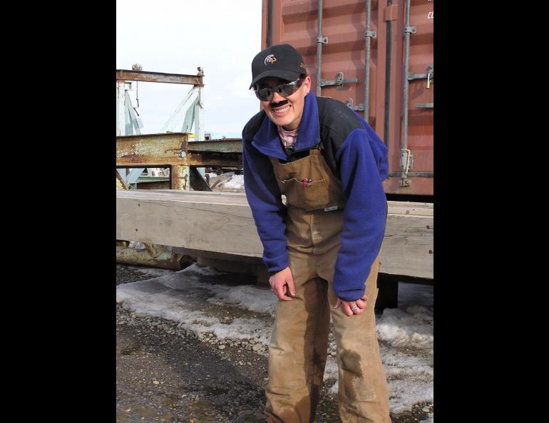 Raven researcher Stacia Backensto disguises herself as an oilfield worker in an attempt to fool ravens she has captured before. Photo by Jim Zelenak.
