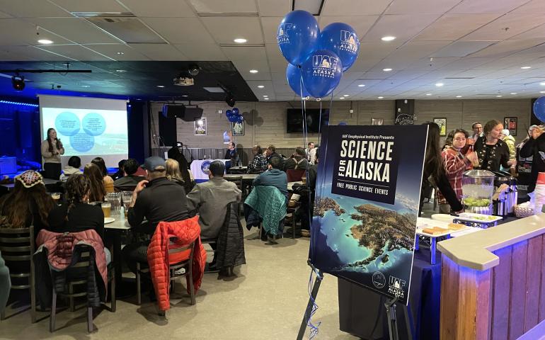 The audience listens to one of several brief science presentations in The Pub at the University of Alaska Fairbanks at the start of the 2023 Science for Alaska talk series. The 2024 talk series begins Thursday, Feb. 1, at The Pub. UAF/GI photo by Rebecca Beltran.