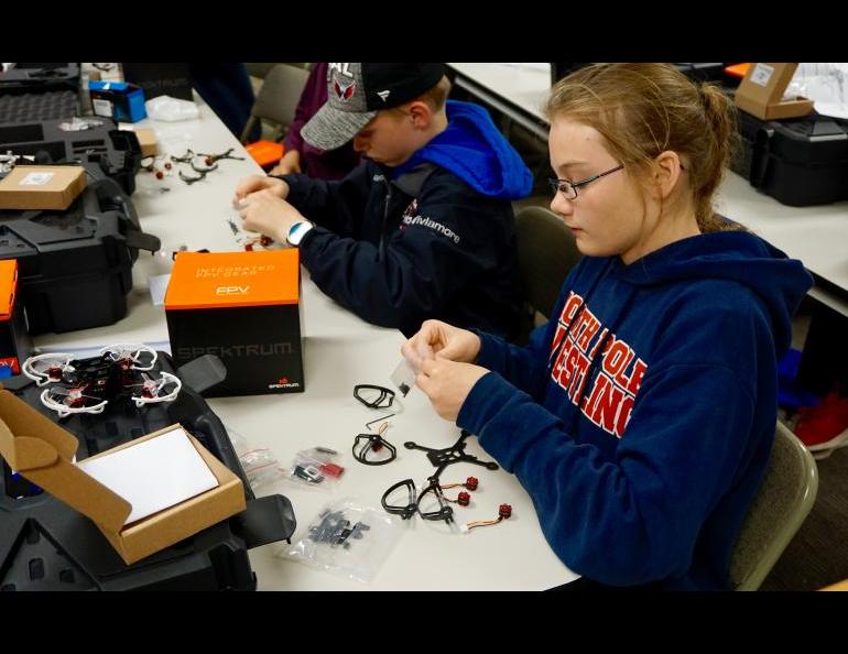Students assemble unmanned aircraft at a camp offered by the University of Alaska Fairbanks and the Federal Aviation Administration in June. The students practiced flying the aircraft and, on the camp’s last day, took them home. Photo by Patty Eagan