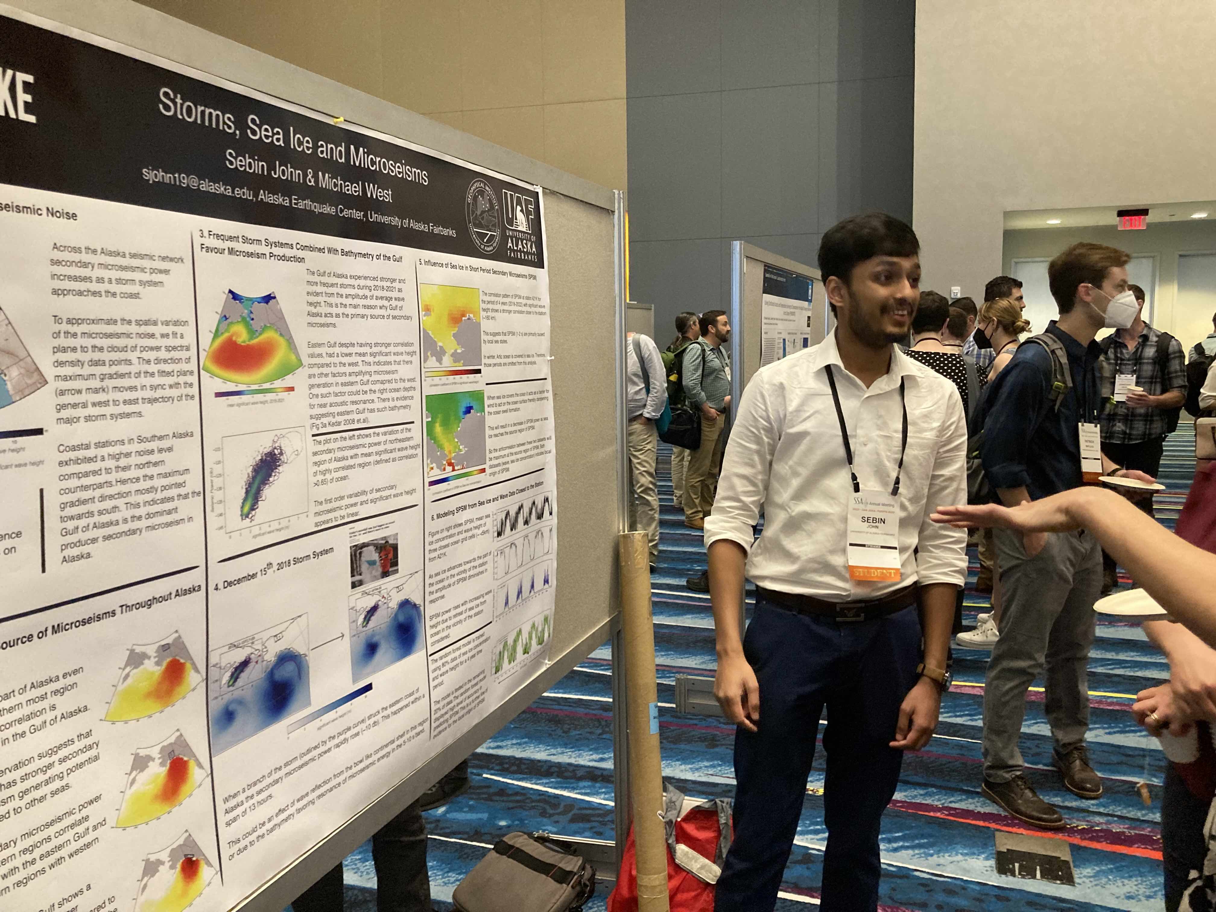 Ph.D. student Sebin John presents his research on observing the impact of ocean storms and sea ice on seismic background noise across Alaska. Photo by Mike West