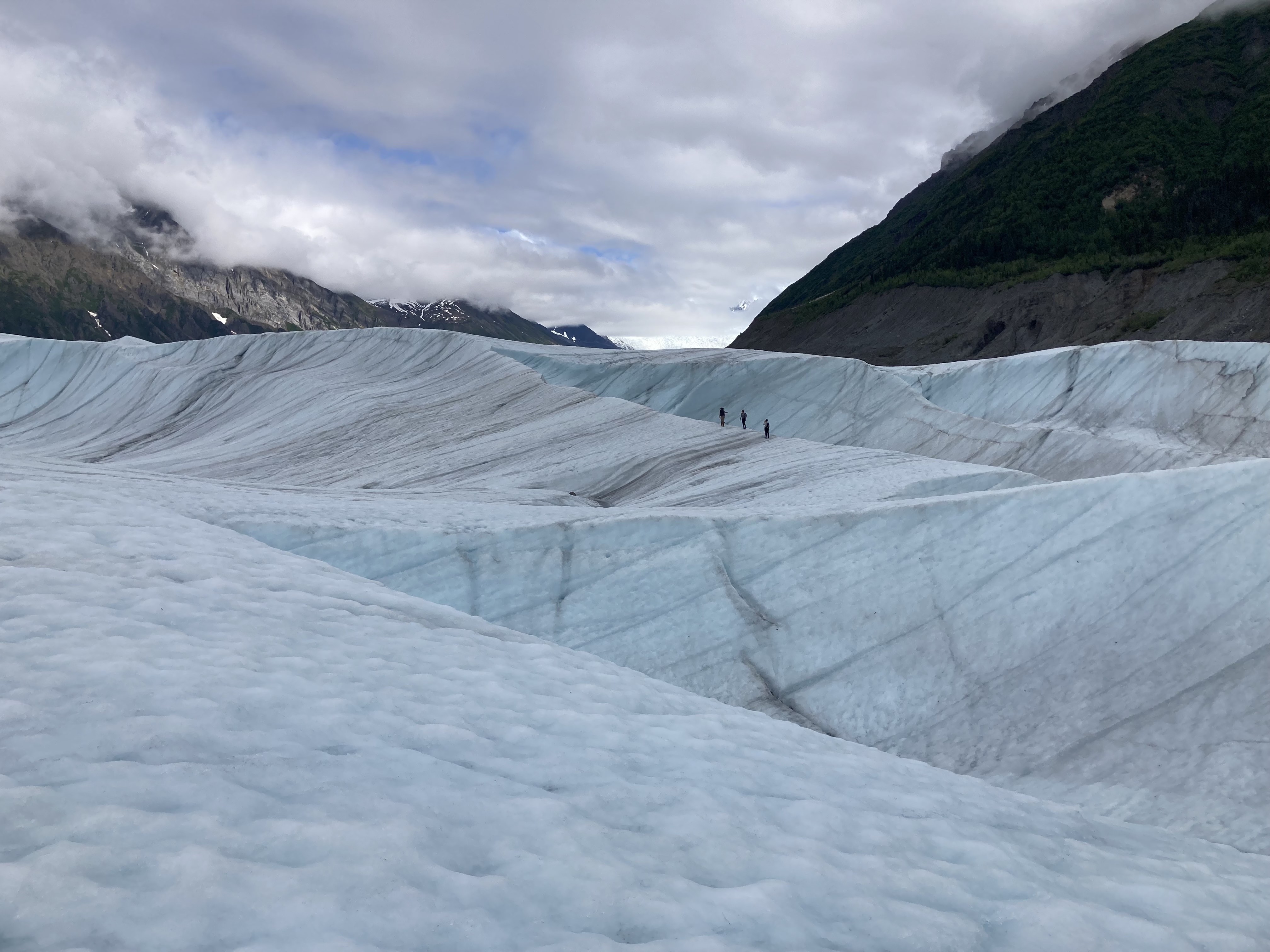 Participants in a 2022 international glaciology summer school walk on Root Glacier near McCarthy, Alaska, in 2022. Photo by Albin Wells