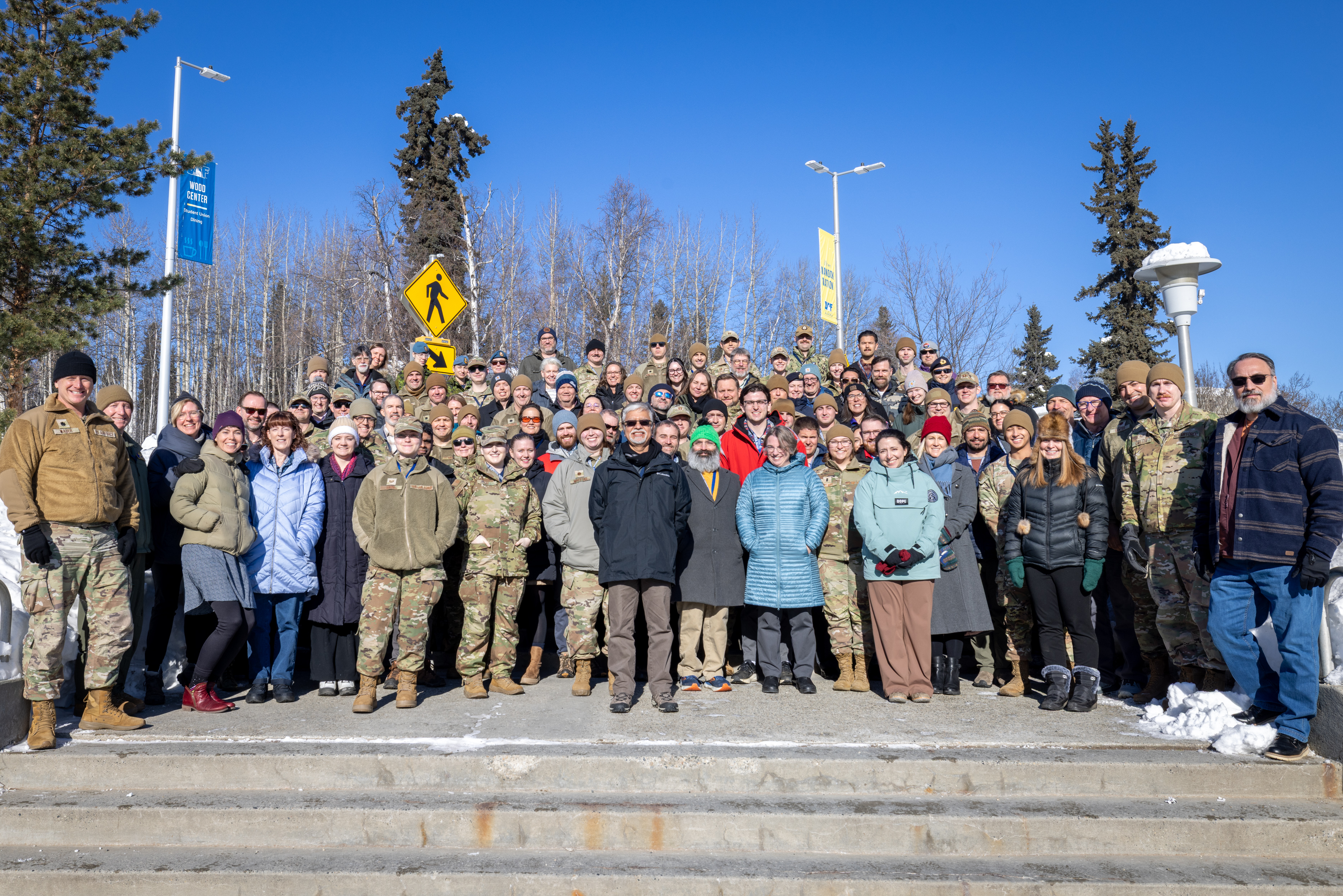 Participants at the 2026 Arctic METOC Partnership Summit pose for a group photo on the UAF campus. Photo by Eric Marshall.