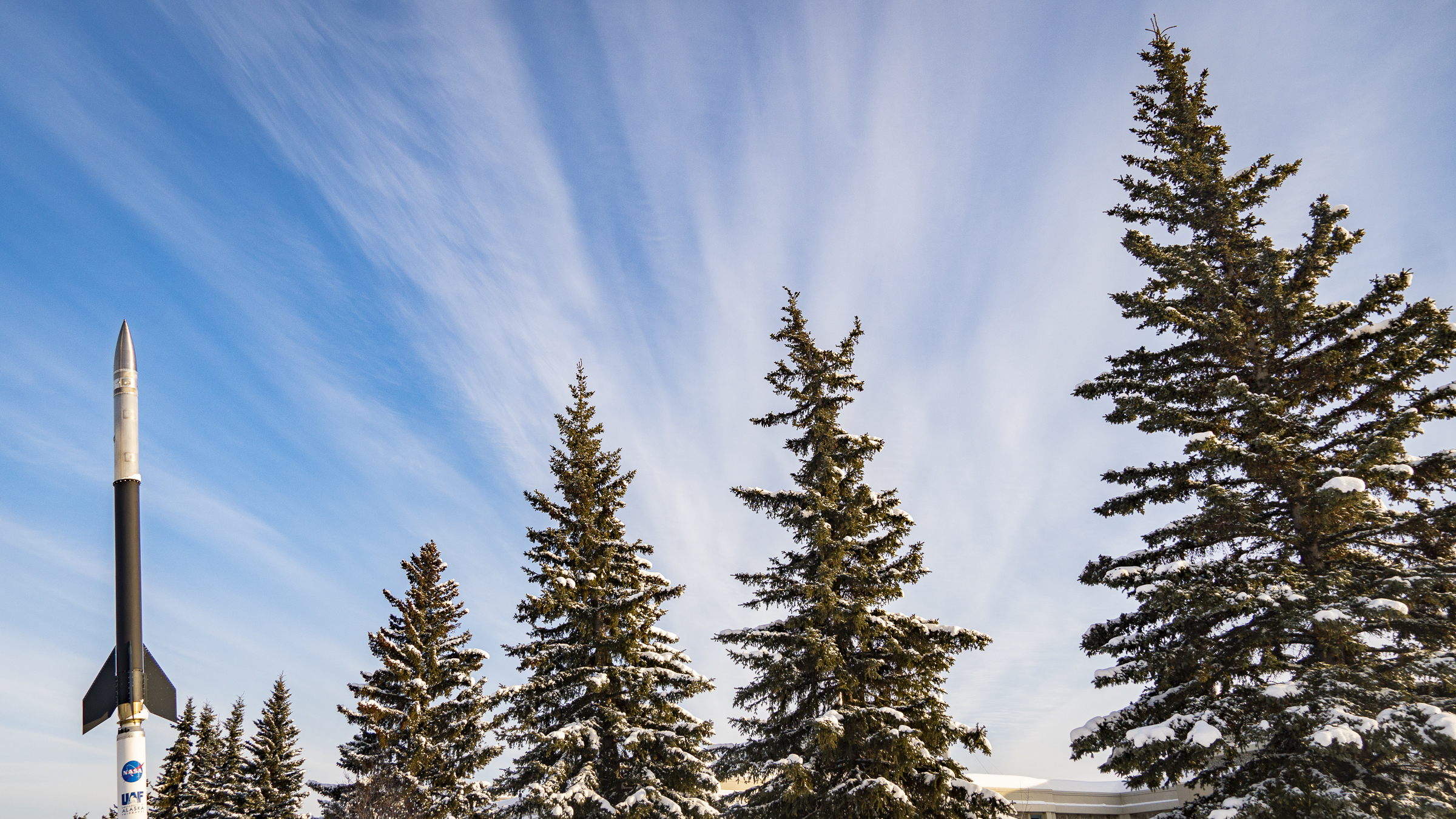 a rocket in front of uaf geophysical institute building
