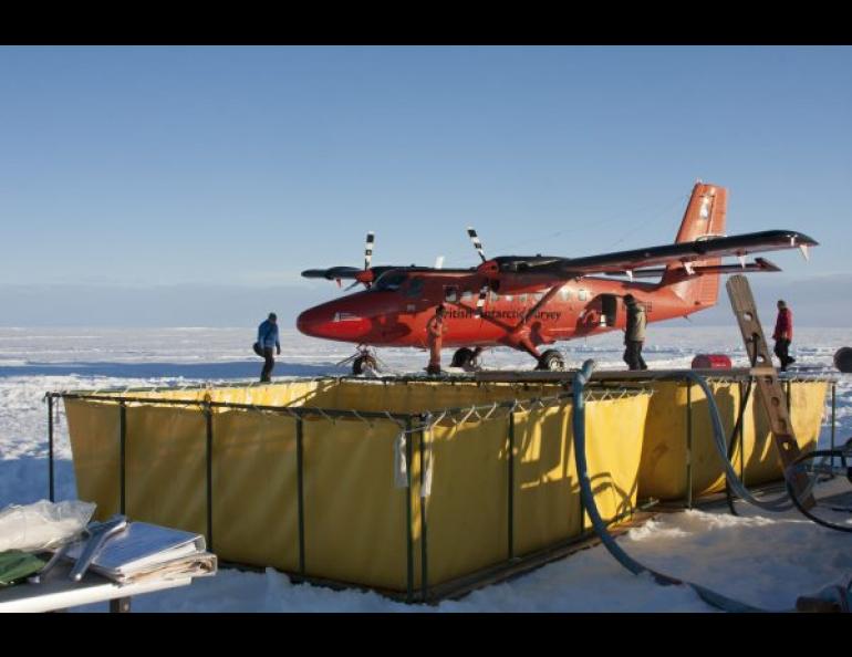 These portable water pools in Antarctica are part of an ice-drilling operation. The system heats the water to about 158 degrees Fahrenheit and pumps it down a hole. The water is recovered and returned to the pool. Photo by Martin Truffer.