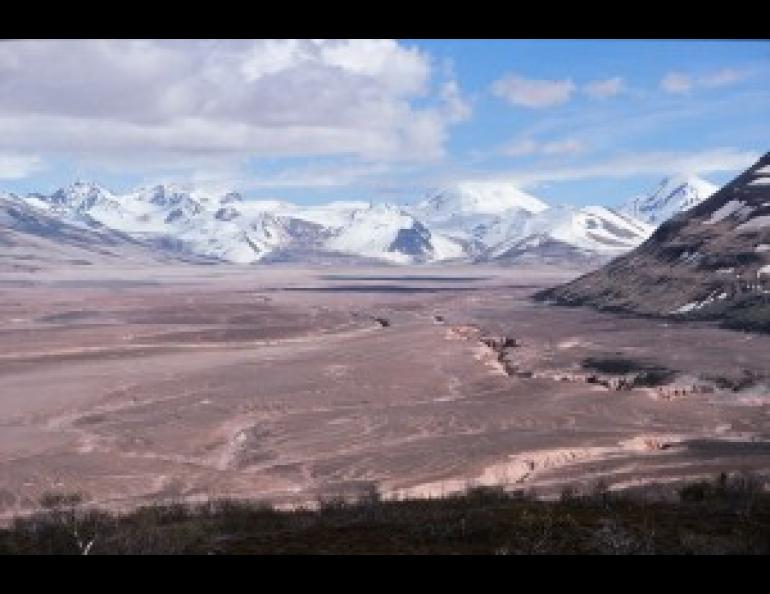 A view up the Valley of Ten Thousand Smokes from the Overlook Cabin above Three Forks in Katmai National Park and Preserve, Alaska. The valley is filled with 200 meters of ash-flow deposits from the 1912 eruption of Novarupta Volcano. Photograph by G. McGimsey, USGS.