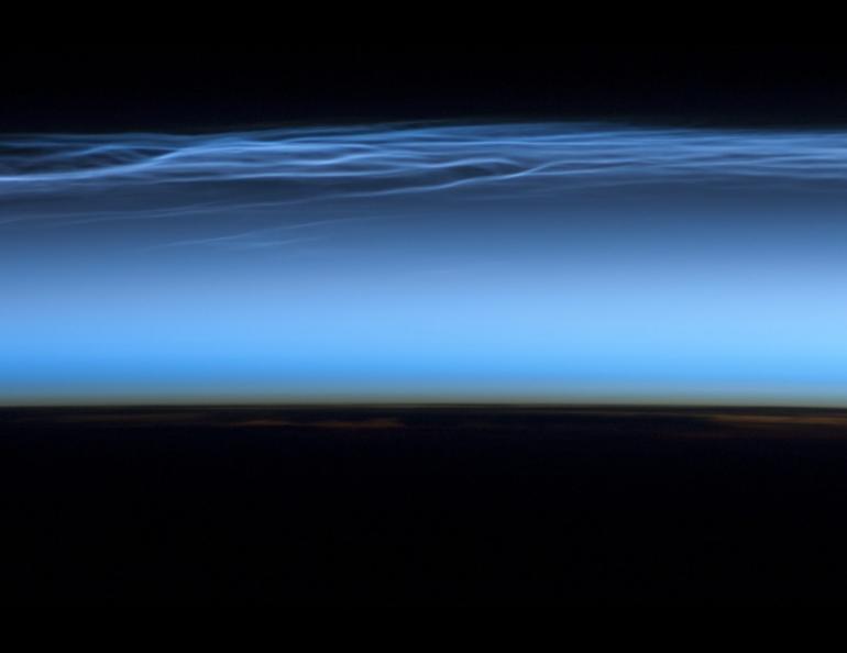 Polar mesospheric clouds appear above the Earth in this photograph by the Expedition 31 crew from the International Space Station on June 13, 2012. Photo by NASA’s Johnson Space Center/International Space Station.