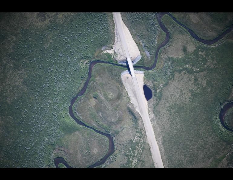 The SeaHunter unmanned aerial aircraft took several thousand high-resolution photographs of the new Inuvik–Tuktoyaktuk Highway in the Northwest Territories, Canada, such as this photo of the ITH crossing Zed Creek. Photo courtesy of Fisheries and Oceans Canada.
