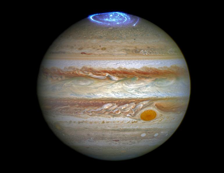 This 2016 image is a composite of two different Hubble observations. The auroras were photographed during a series of Hubble Space Telescope Imaging Spectrograph far-ultraviolet-light observations taking place as NASA's Juno spacecraft approaches and enters into orbit around Jupiter. Credits: NASA