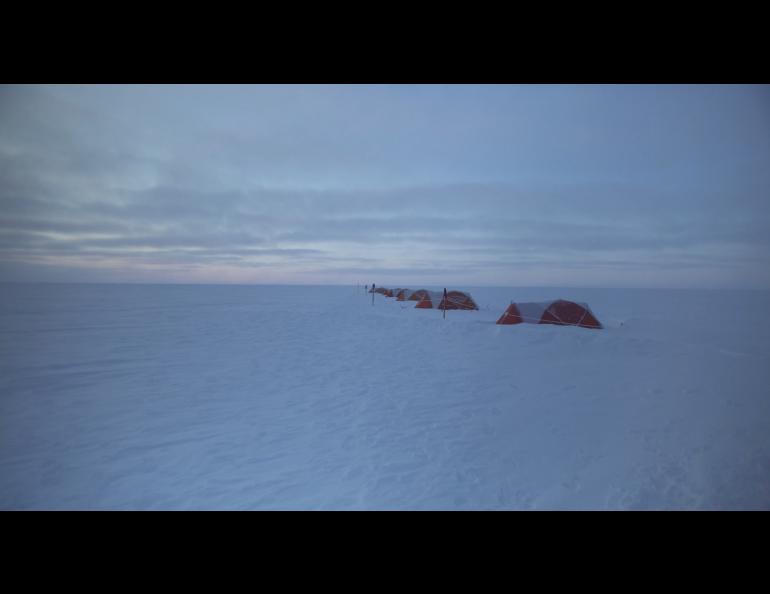 The research team’s tents sit on the Greenland ice sheet in the film “Utuqaq.” Photo courtesy of Iva Radivojevic