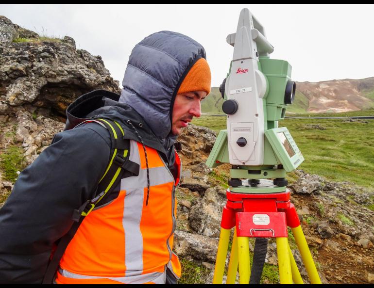 Alexandru Lapadat during fieldwork in Theistareykir, Iceland. "I was having my first encounter with the harsh Icelandic weather in July 2018. Establishing geodetic networks was and still is one of my favorite tasks as a geodesist.”