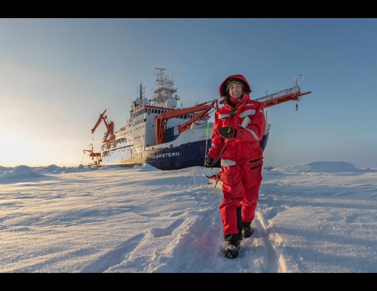 Melinda Webster tows a sled while working near the German research vessel Polarstern, on which she spent 126 days in 2020. Photo by Lianna Nixon
