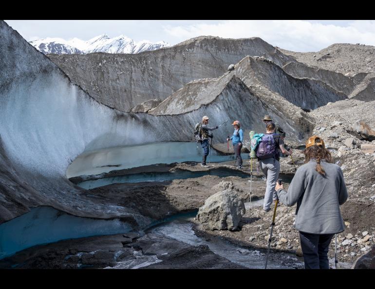 Eric Petersen explains to Hannah Perrine Mode and the rest of the group some of the processes they're observing on the Kennicott glacier. Photo by Julian Dann