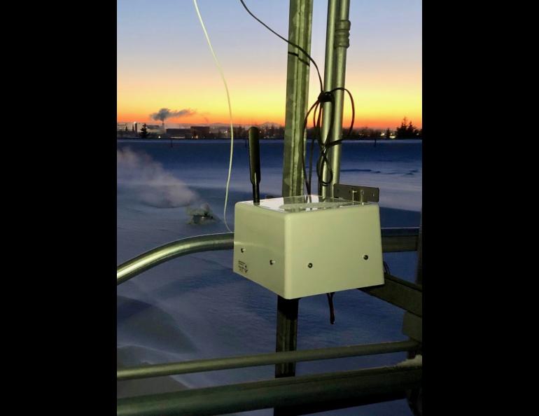 A Praxis air quality sensor on the roof of the UAF Community and Technical College in Fairbanks measures gases and particulate matter. Another sensor is at ground level. Photo by Meeta Cesler-Maloney