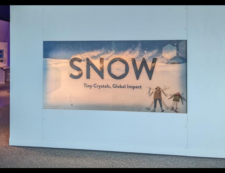 A sign greets visitors at the "Snow: Tiny Crystals, Global Impact" exhibit in Portland, Oregon. Photo by Molly Schmitz