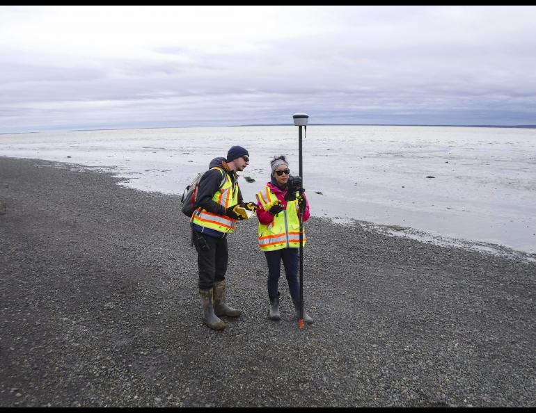 Graduate student Reyce Bogardus and Roberta Glenn survey Kanakanak Beach using real-time kinematic GPS May 28, 2021, in Dillingham, Alaska. UAF/GI photo by Chris Maio.