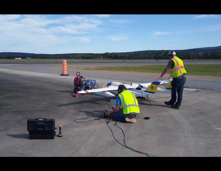 ACUASI team members Joncy Walden and Justin Humphrey tune the fuel injection on a SeaHunter’s left engine in Canada in 2020. Photo by Andrew Wentworth