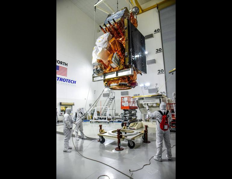 Technicians lift the JPSS-2 satellite to a stand inside the Astrotech Space Operations facility at Vandenberg Space Force Base in California. Photo by Steven Gerl, U.S. Space Force