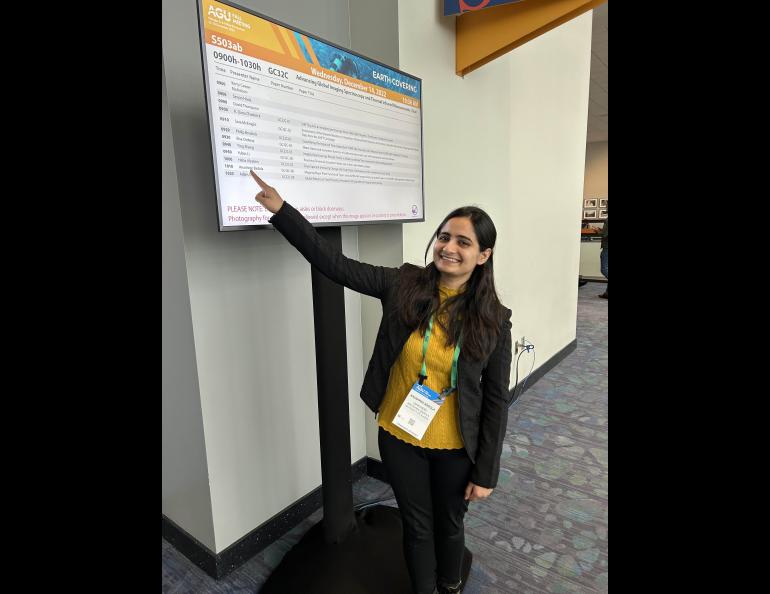 Anushree Badola points to her name on the American Geophysical Union talk schedule. Photo by Rod Boyce