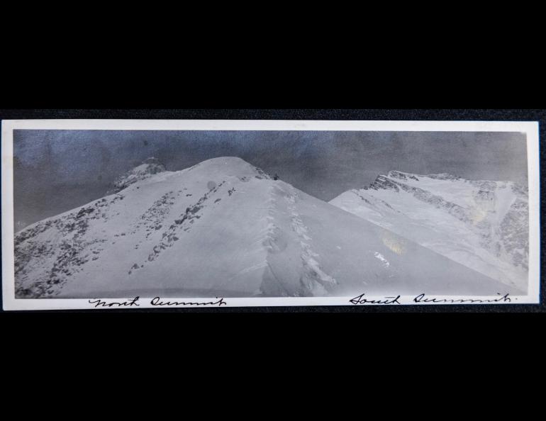 A climber is seen in the distance at about 13,000 feet on what today is known as Karstens Ridge. Indentations to the left are believed to be from a 14-foot spruce flagpole. Archive photo