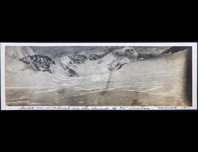 This photograph at about 14,500 feet looks down what today is known as Harper Glacier. The shadow of a climber’s head and alpenstock in the lower right indicate the time was about 4 p.m. This photo is mislabeled as March 1911. Archive photo