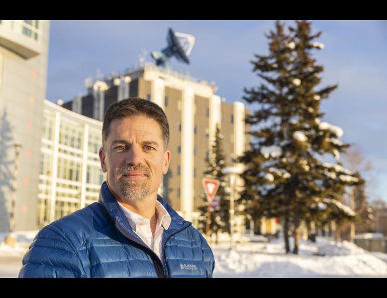 Alaska Satellite Facility Director Wade Albright, with the Elvey Building behind him at the University of Alaska Fairbanks. ASF is located in the Elvey Building. Photo by JR Ancheta