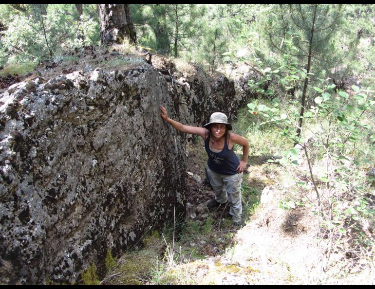 During a 2013 research trip in the Kutahya region of western Turkey, Ezgi Karasözen leans on the fault scarp left by the 1970 magnitude 7.2 Gediz earthquake. Photo courtesy Ezgi Karasözen