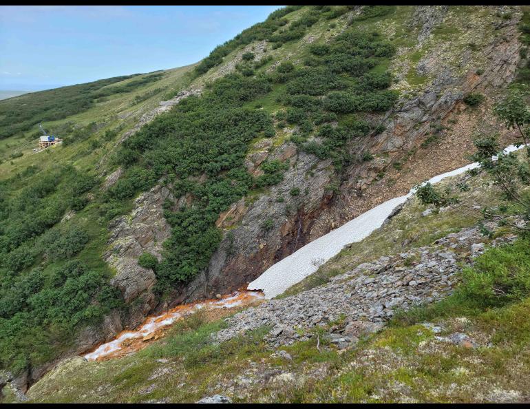 The ore body containing graphite is shown in this 2021 photo of Graphite Creek. At far left is a Graphite One drill rig. Photo by George Case, U.S. Geological Survey.