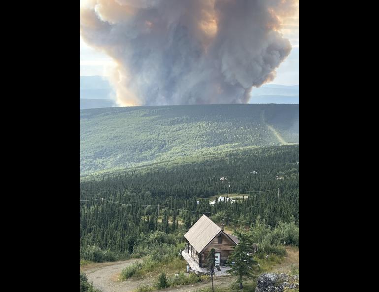 The Lost Horse Creek Fire smoke column rises north of Fairbanks in early August 2023. Photo by Togie Whiel/Alaska Incident Management Team.