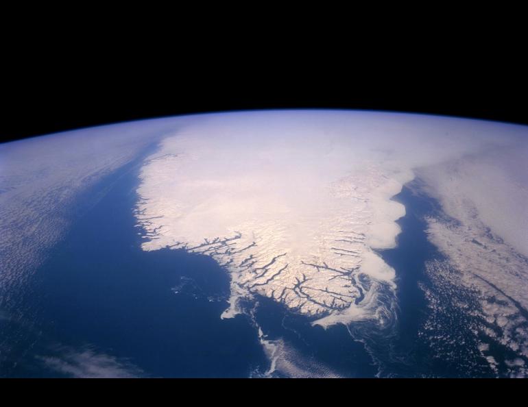 The Greenland Ice Sheet, shown here in June 2017, contains approximately 700,000 cubic miles of ice that would raise the global sea level by about 24 feet if it were to melt completely. Photo courtesy of NASA.