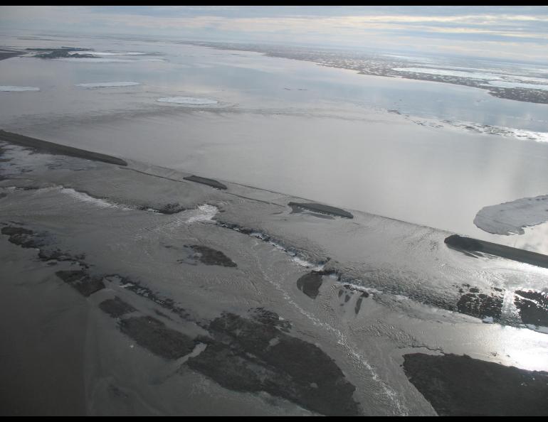 Floodwaters flow over and erode the Dalton Highway on May 21, 2015. The flooding contributed to a slow subsiding of ground in the permafrost-rich region. Photo courtesy of the Alaska Department of Transportation and Public Facilities.