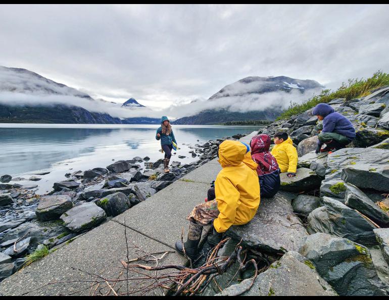 Serina Wesen of the Geophysical Institute teaches a small group of students about glaciers and how they formed the surrounding valley and Portage Lake. Photo courtesy KMTA.