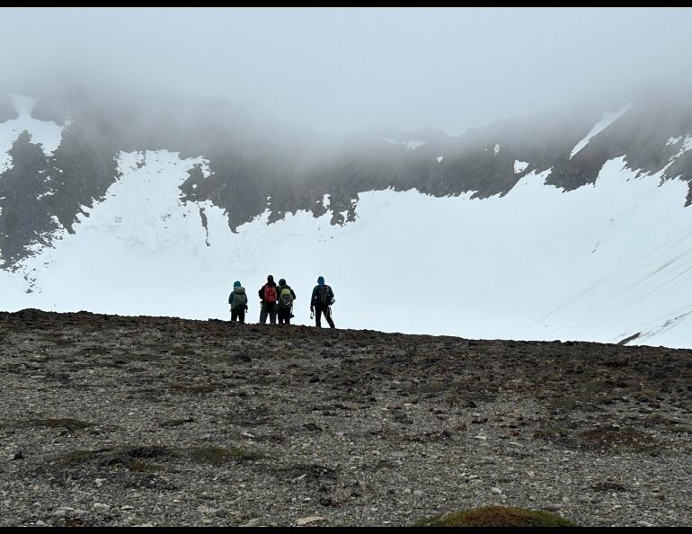 Four members of an international science team led by the University of Alaska Fairbanks Geophysical Institute stand at the rim of Mount Edgecumbe volcano in Southeast Alaska in early June 2023. Photo by Rod Boyce.