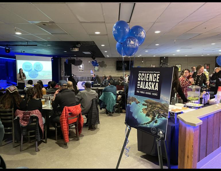 The audience listens to one of several brief science presentations in The Pub at the University of Alaska Fairbanks at the start of the 2023 Science for Alaska talk series. The 2024 talk series begins Thursday, Feb. 1, at The Pub. UAF/GI photo by Rebecca Beltran.