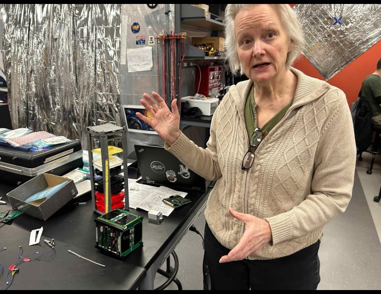 Denise Thorsen explains some of the work underway by students in the UAF Fairbanks Space Systems Engineering Program earlier this year. Photo by Rod Boyce.