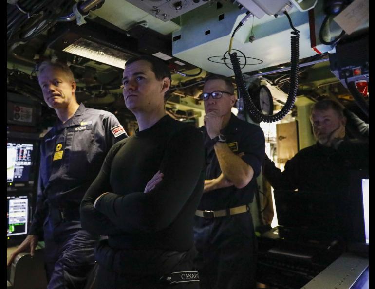 Rear Adm. Andrew Miller, commander of the Undersea Warfighting Development Center, right, gives a tour of the fast-attack submarine USS Indiana while surfaced near Ice Camp Whale during Operation Ice Camp on March 13, 2024. U.S. Navy photo