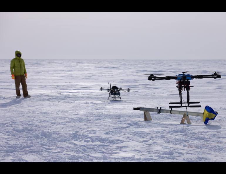 UAF postdoctoral fellow Achille Capelli watches as a drone lifts off with the science instrument he designed and built. Photo by Bryan Whitten