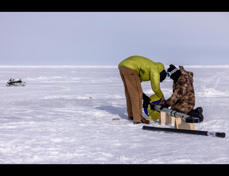 UAF postdoctoral fellow Achille Capelli and Ph.D. student Thimira Asurapmudalige prepare the Lightweight Airborne Snow and Sea Ice Thickness Observing System for flight. Photo by Bryan Whitten