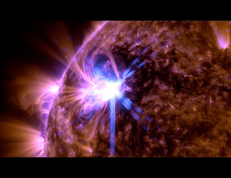 A solar flare flashes in the sun’s corona on Feb. 21, 2024. The image shows a blend of 171 Angstrom and 131 Angstrom light, subsets of extreme ultraviolet light that highlight plasma loops in the corona and extremely hot material in flares, respectively. Photo by NASA/Solar Dynamics Observatory
