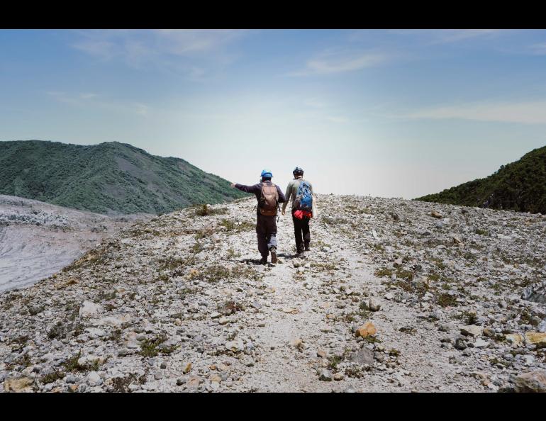 David Benavente, left, and Noé García-Martínez, both of the University of Alicante in Spain, walk along the crater rim at Poás volcano. Photo by Martina Picciallo 