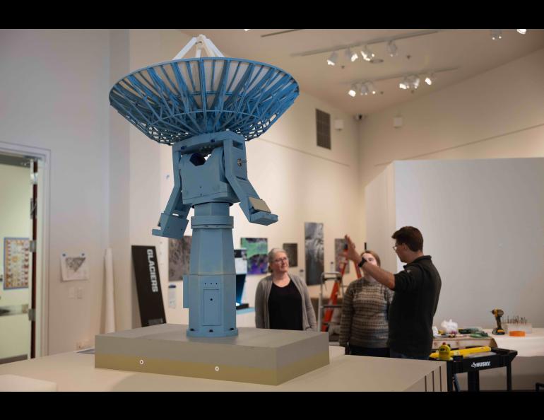 Roger Topp, right, and his team discuss the setup for a model of the antenna that sits atop the University of Alaska Fairbanks Elvey Building. UAF/GI photo by Bryan Whitten