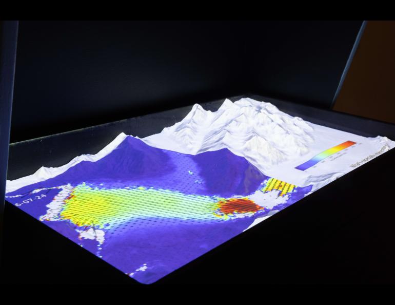 An interactive display shows how velocities of flowing glacier ice can be calculated using ASF satellite imagery data. UAF/GI photo by Bryan Whitten