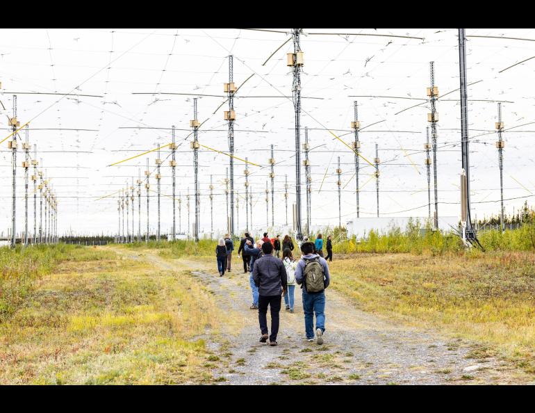 Visitors at the 2022 HAARP open house walk to the facility’s 33-acre antenna array. UAF/GI photo