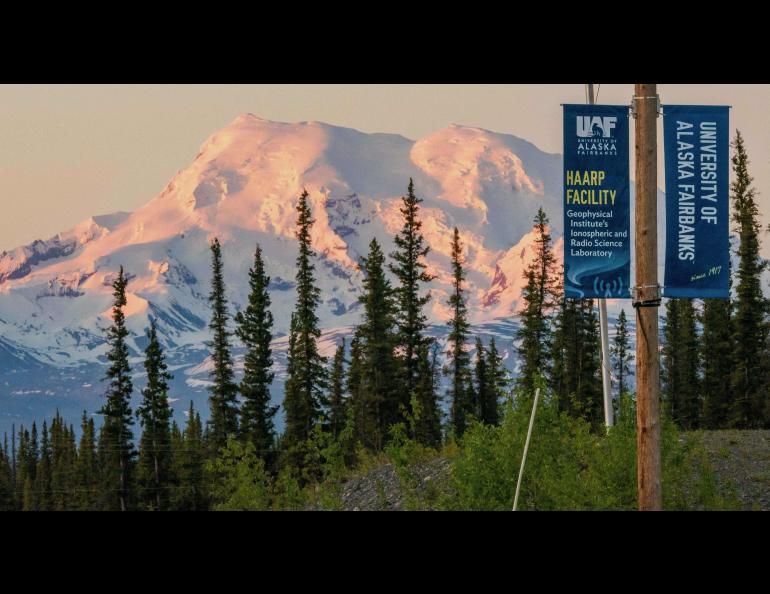 A sign at the HAARP facility entrance notes that the research site is operated by the University of Alaska Fairbanks Geophysical Institute. Mount Drum rises in the background. UAF/GI photo
