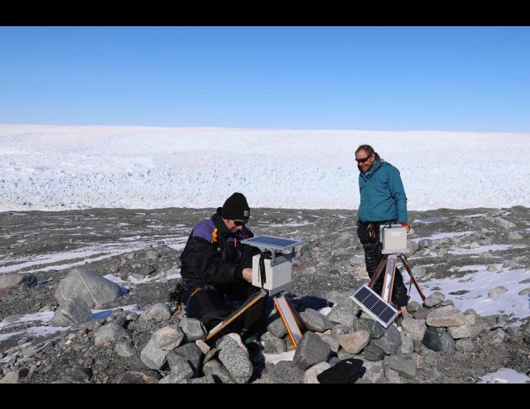 University of Alaska Southeast professor Jason Amundson, left, and University of Alaska Fairbanks professor Martin Truffer work at a Jakobshavn Glacier instrument site. Photo by Amy Jenson