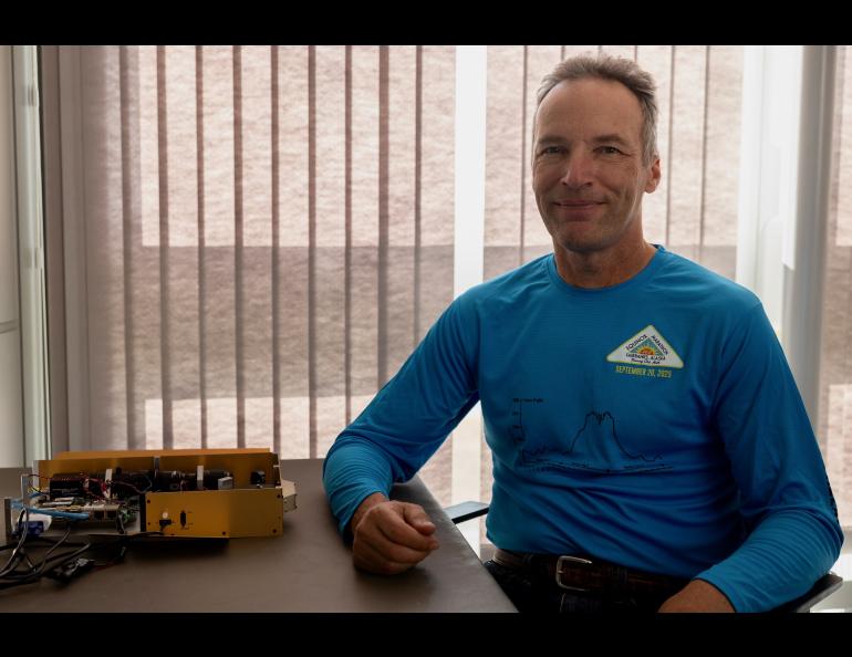Associate research professor Carl Schmitt with the cloud particle imager he developed. Photo by Bryan Whitten