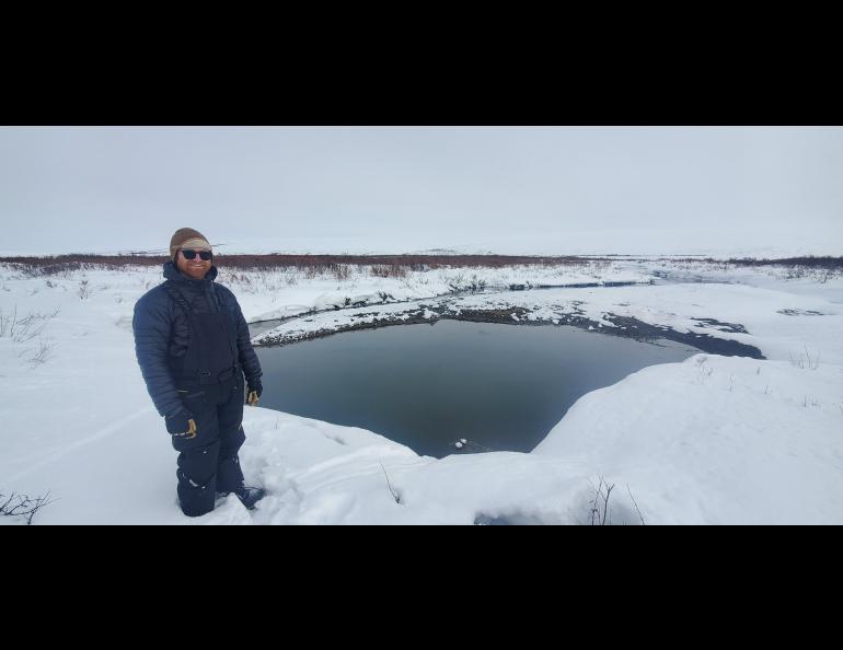 Tom Glass stands on a beaver dam on the Seward Peninsula in April 2025. Photo by Sebastian Zavoico