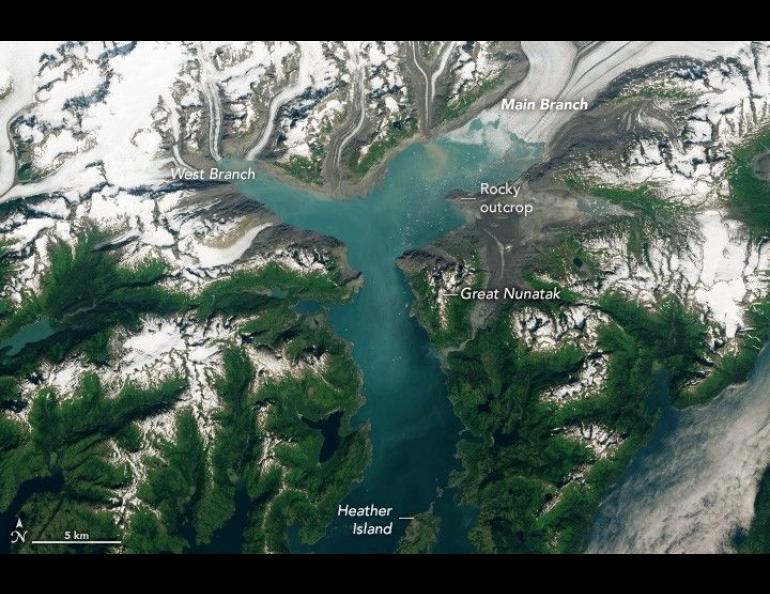 A labeled satellite image shows Columbia Glacier in Alaska with its Main Branch and West Branch flowing into a blue-green fjord, alongside features including a rocky outcrop, Great Nunatak, and Heather Island.